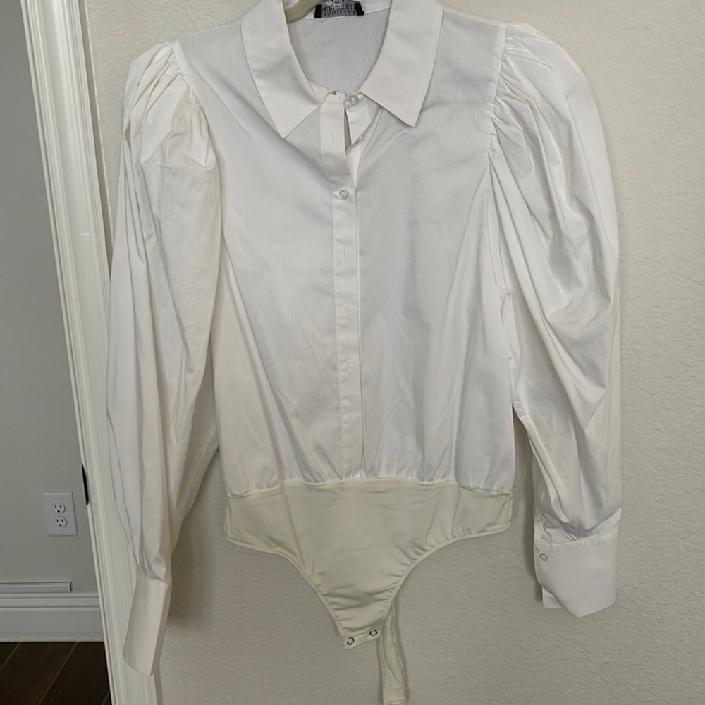 Danielle Bernstein white collard body suit